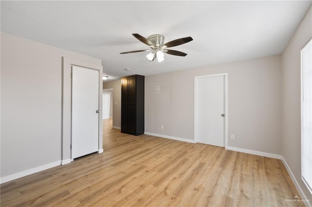 unfurnished room featuring ceiling fan and light hardwood / wood-style floors