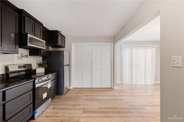 kitchen with appliances with stainless steel finishes and light wood-type flooring