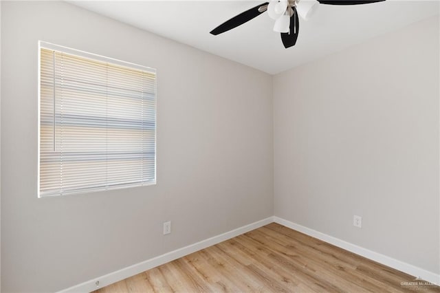 spare room featuring light hardwood / wood-style flooring and ceiling fan