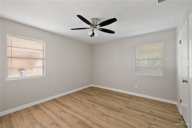 spare room with light hardwood / wood-style floors and ceiling fan