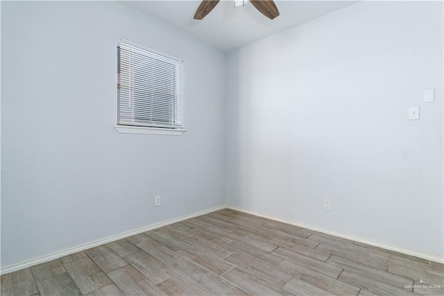 empty room featuring ceiling fan and light hardwood / wood-style floors