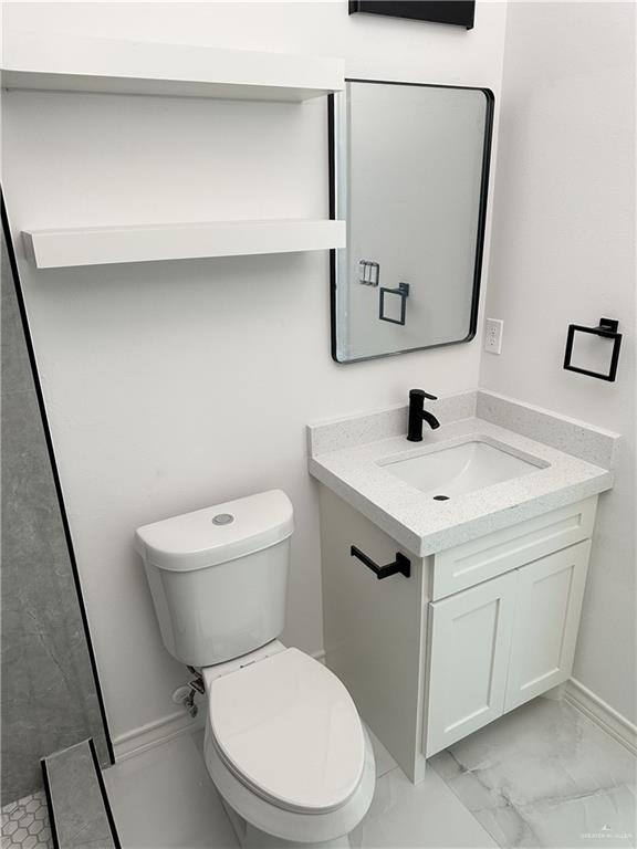 bathroom with vanity and toilet