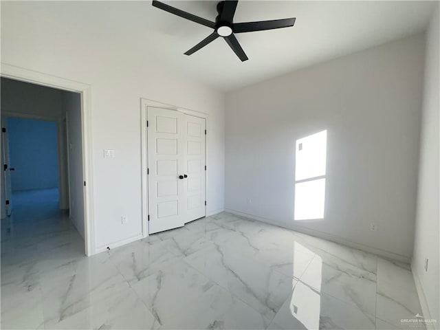 unfurnished bedroom featuring ceiling fan