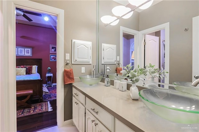 ensuite bathroom with double vanity, a sink, and ensuite bathroom