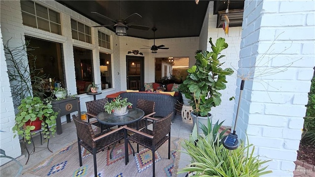 view of patio / terrace with a ceiling fan and an outdoor living space