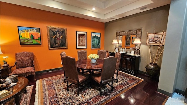 dining area with dark hardwood / wood-style flooring