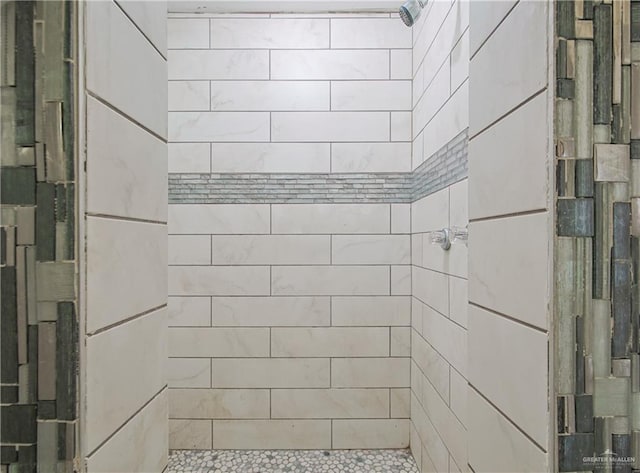 full bathroom with tiled shower