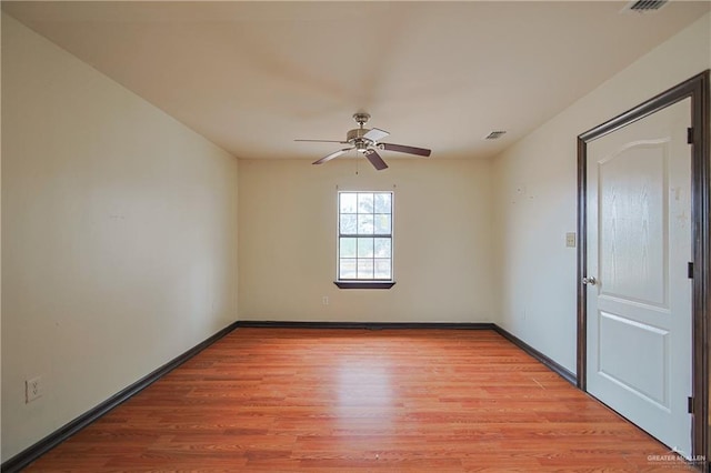 spare room featuring ceiling fan and light wood-type flooring