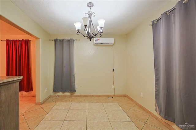 unfurnished dining area featuring light tile patterned floors, baseboards, a chandelier, and an AC wall unit