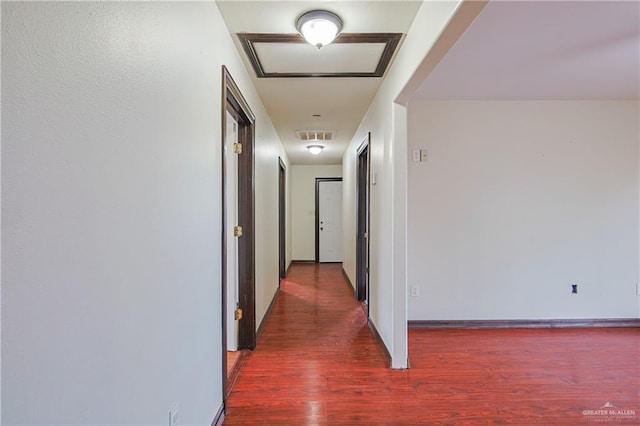 hallway featuring dark hardwood / wood-style flooring