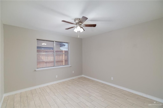 empty room featuring ceiling fan and light hardwood / wood-style flooring