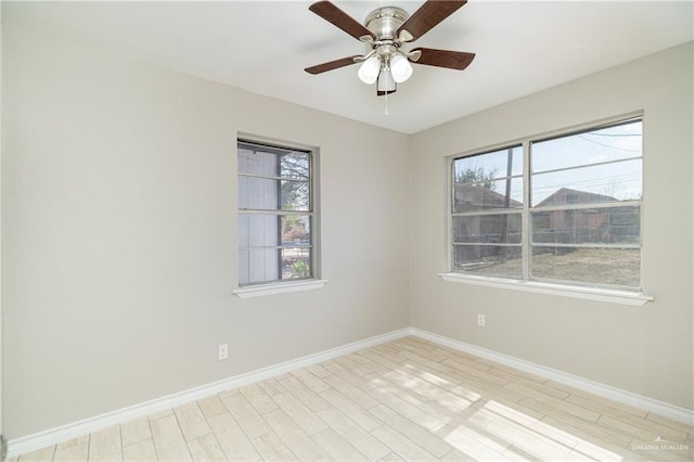 empty room featuring ceiling fan and light wood-type flooring