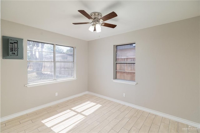 unfurnished room featuring light hardwood / wood-style flooring and ceiling fan