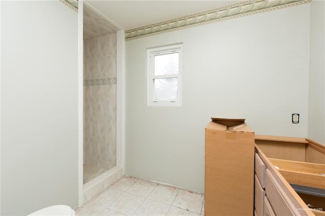 bathroom featuring tile patterned floors and a shower