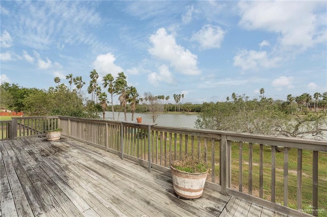 wooden deck featuring a water view