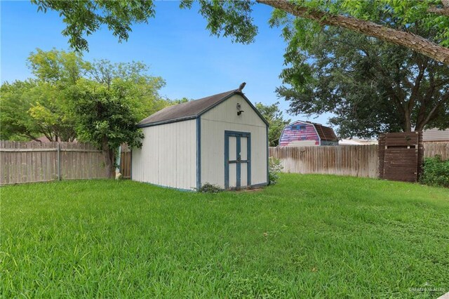 view of shed featuring a fenced backyard