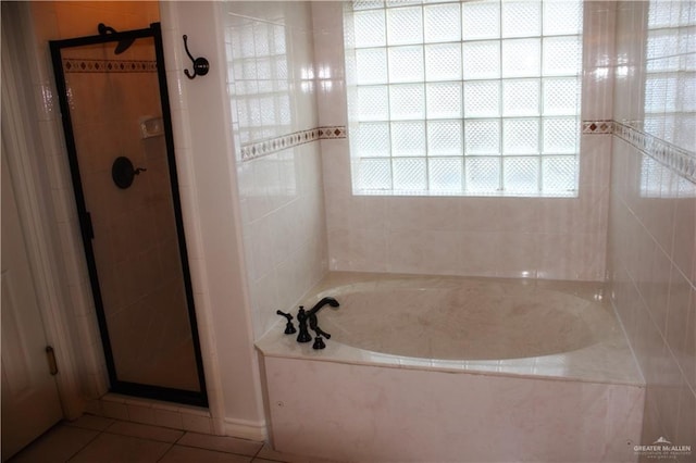 bathroom with tile patterned flooring and plus walk in shower