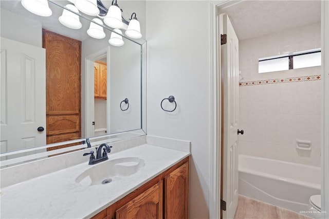 full bathroom with vanity, toilet, and tub / shower combination