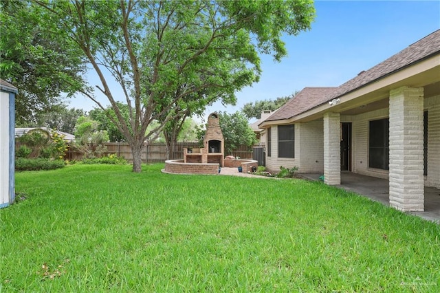 view of yard featuring fence, exterior fireplace, a patio area, and cooling unit