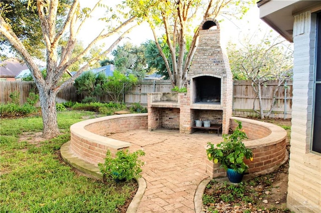 view of patio / terrace featuring a fireplace