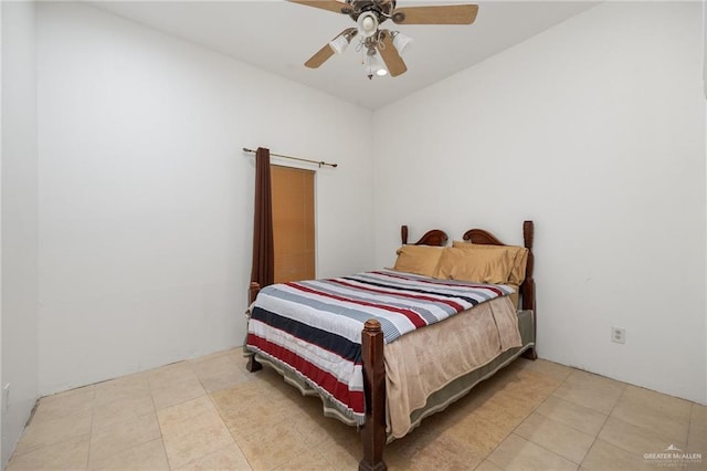 tiled bedroom with ceiling fan