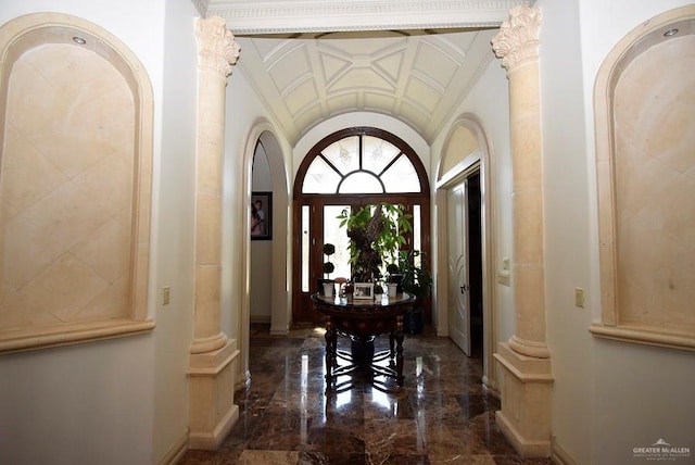 interior space with decorative columns and ornamental molding