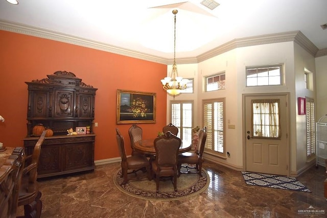 dining area featuring an inviting chandelier and ornamental molding