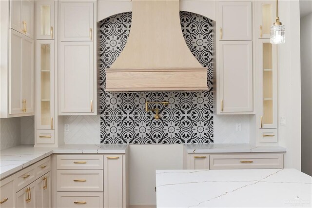 8100 Coyote Dr, Mission, TX 78574 - kitchen with glass insert cabinets, backsplash, and white cabinets