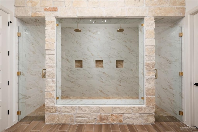 8100 Coyote Dr, Mission, TX 78574 - bathroom featuring wood tiled floors and a marble finish shower