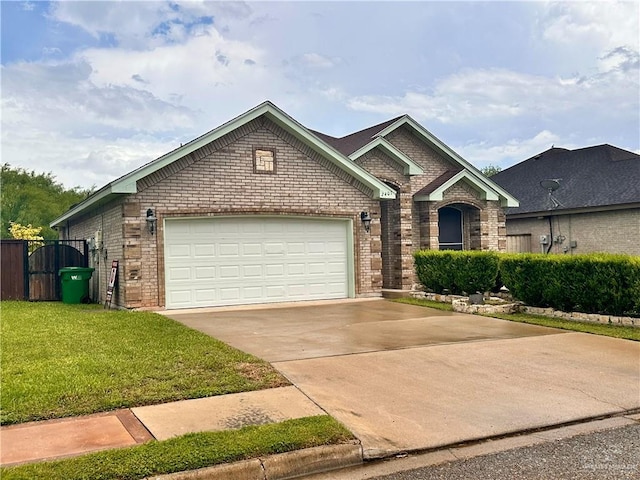 2401 S Gardenia St, Pharr, TX 78577 - view of front of house with brick siding, concrete driveway, and a garage