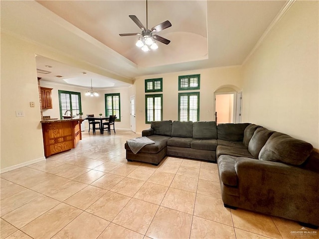 2401 S Gardenia St, Pharr, TX 78577 - living area featuring a tray ceiling, light tile patterned floors, a ceiling fan, baseboards, and ornamental molding
