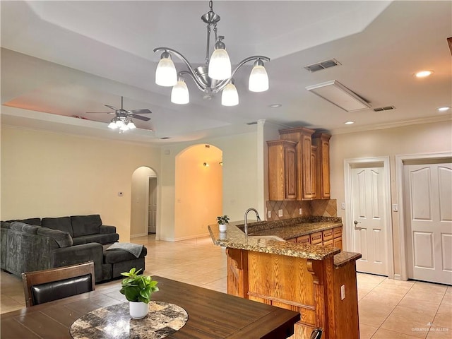2401 S Gardenia St, Pharr, TX 78577 - dining area featuring arched walkways, light tile patterned floors, recessed lighting, ornamental molding, and a ceiling fan