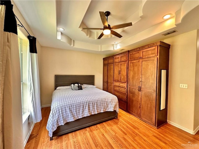 2401 S Gardenia St, Pharr, TX 78577 - bedroom with a raised ceiling, light wood-style flooring, baseboards, recessed lighting, and a ceiling fan