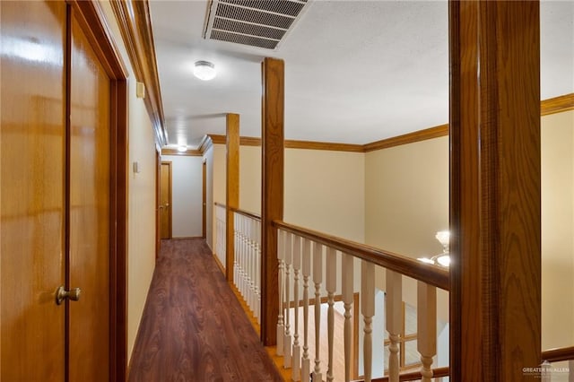 corridor featuring crown molding and dark wood-type flooring