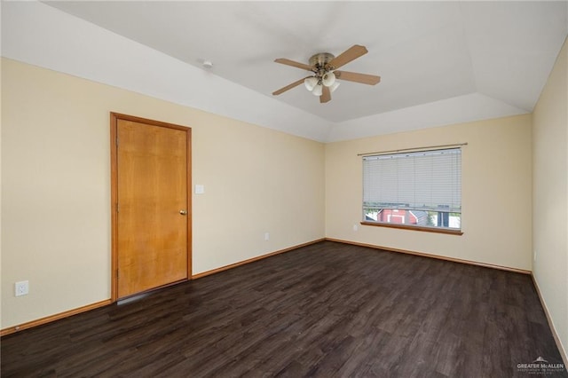 unfurnished room featuring dark hardwood / wood-style floors, ceiling fan, and vaulted ceiling