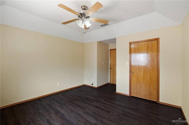 unfurnished bedroom with ceiling fan, a closet, and dark hardwood / wood-style floors