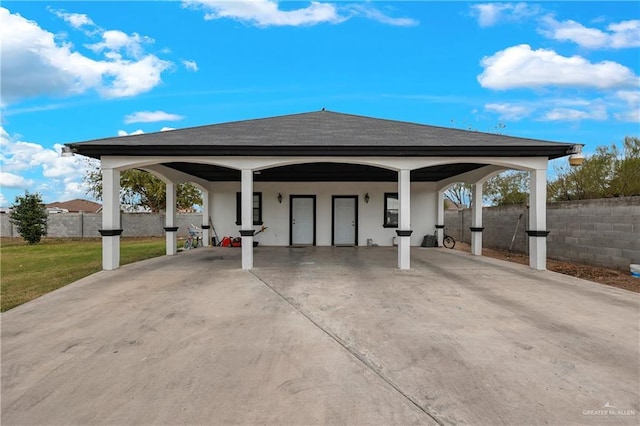 exterior space with a carport