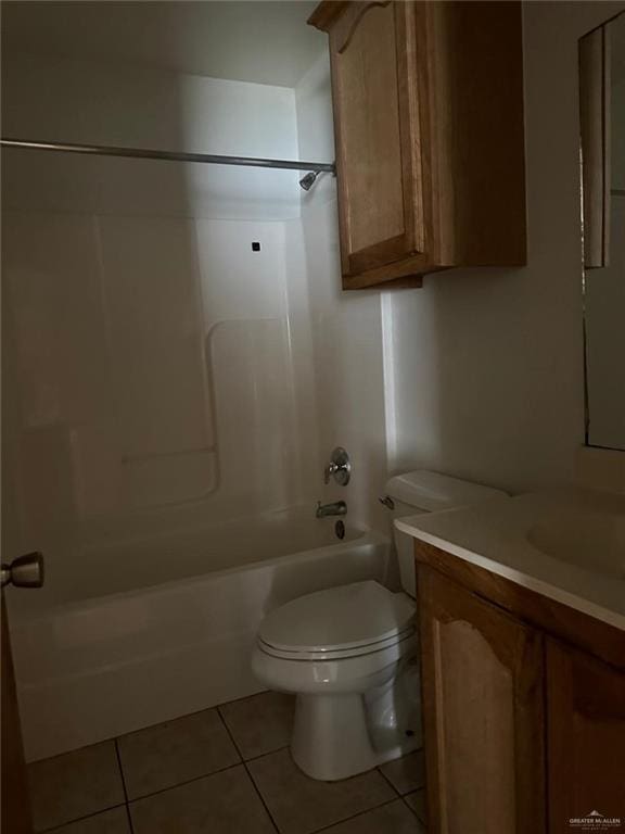 bathroom featuring toilet, tile patterned floors, vanity, and shower / tub combination