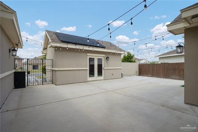 back of property featuring a patio area and french doors