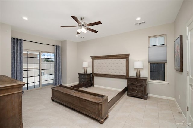 tiled bedroom featuring ceiling fan