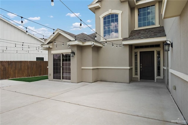 view of exterior entry featuring a patio area