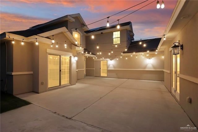 view of patio terrace at dusk