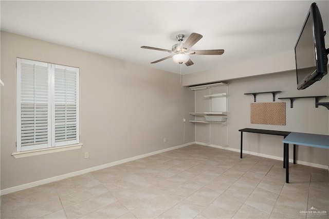 tiled empty room with ceiling fan