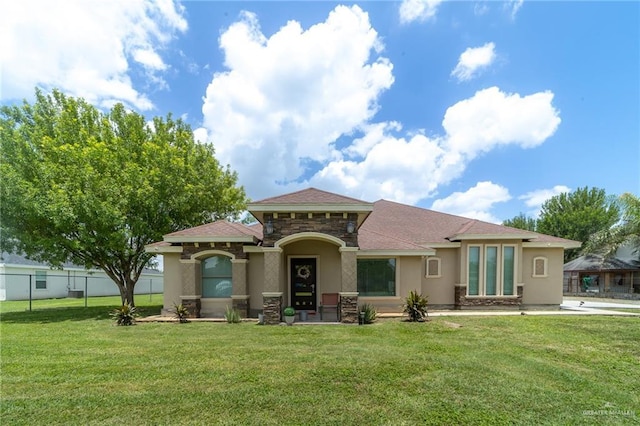 1833 Cortez Dr, Alamo, TX 78516 - rear view of property with stucco siding, stone siding, and a shingled roof