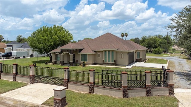 1833 Cortez Dr, Alamo, TX 78516 - mediterranean / spanish-style home with a fenced front yard, driveway, and stucco siding