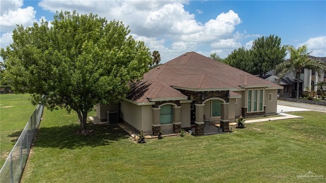 1833 Cortez Dr, Alamo, TX 78516 - back of house featuring stucco siding and roof with shingles