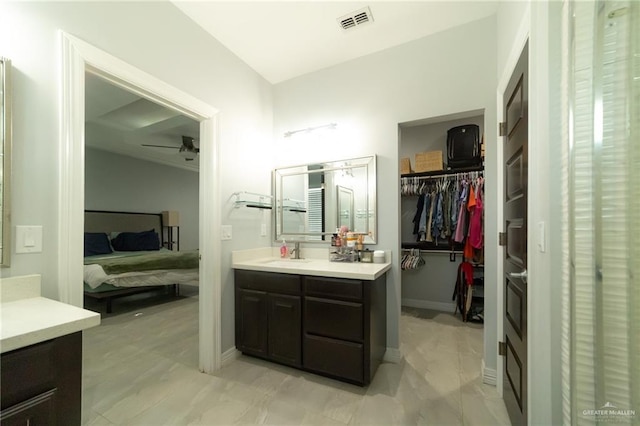 1833 Cortez Dr, Alamo, TX 78516 - full bathroom with ensuite bathroom, vanity, a ceiling fan, and a walk in closet