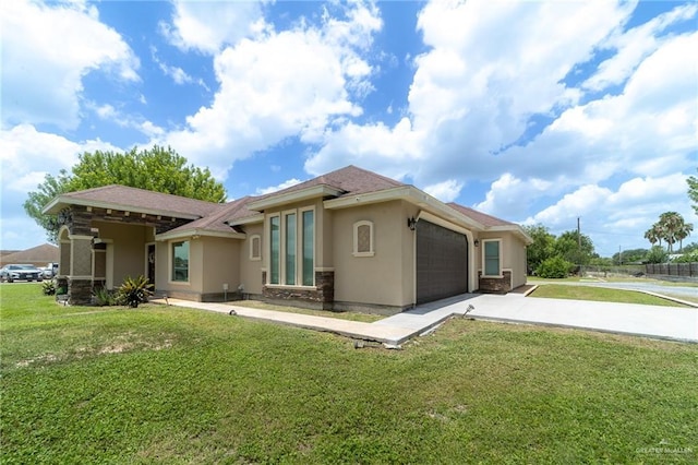1833 Cortez Dr, Alamo, TX 78516 - rear view of house with stucco siding, driveway, and an attached garage