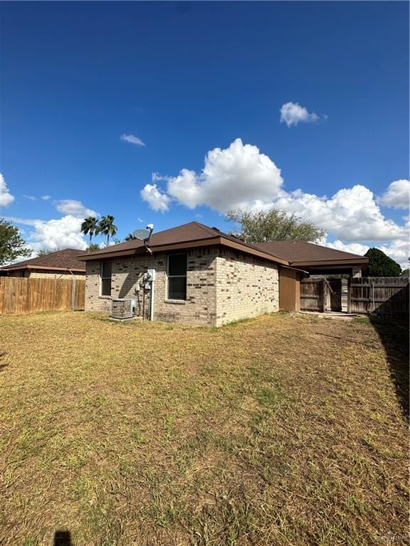 9205 N 31st St, Mcallen, TX 78504 - back of house featuring a yard