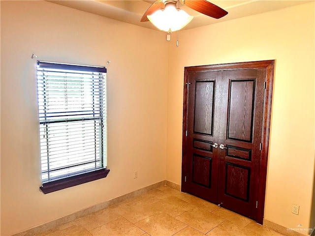 foyer with ceiling fan